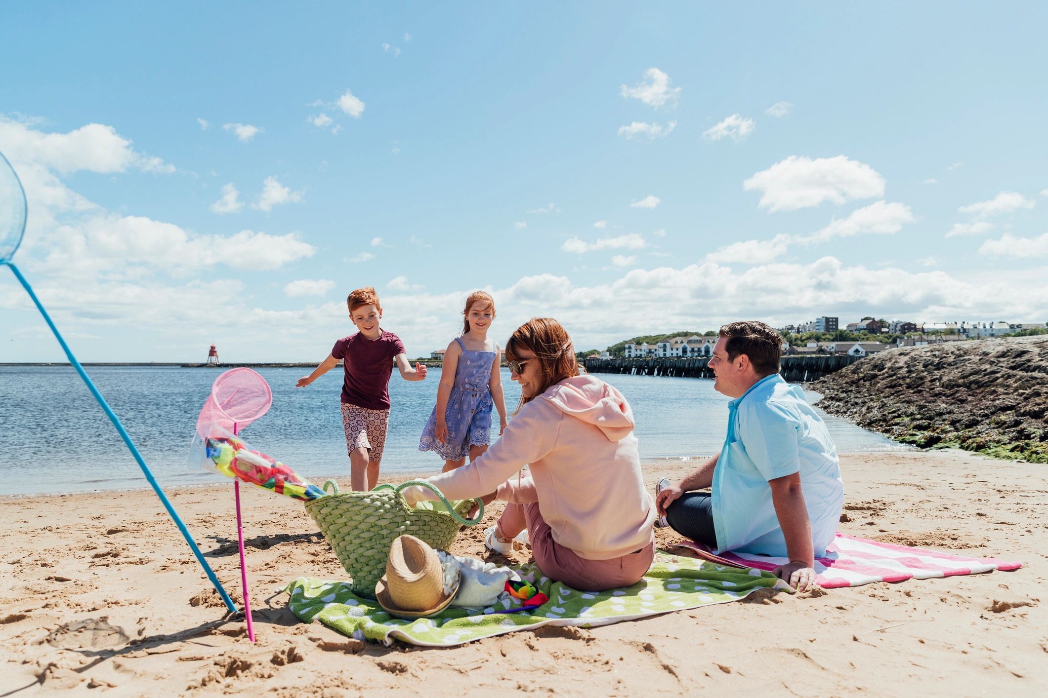 Family relaxing together on a beach