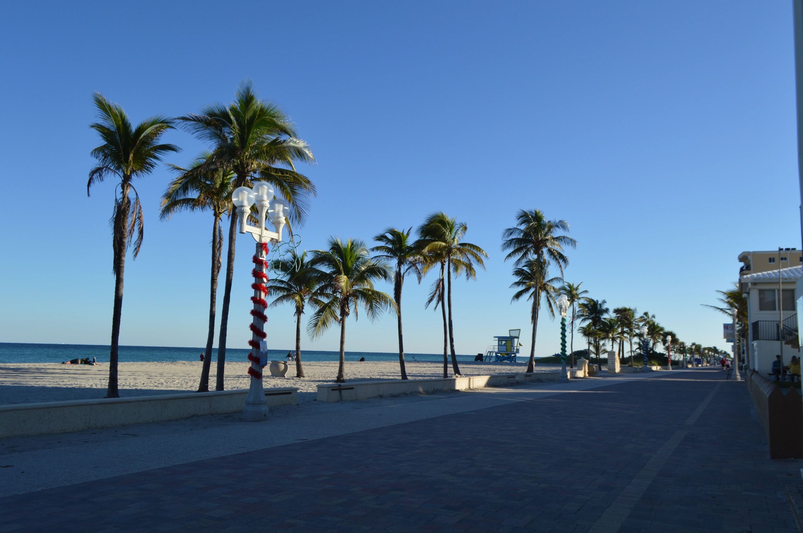 Wide view of a sunny Southeast Florida beach shoreline
