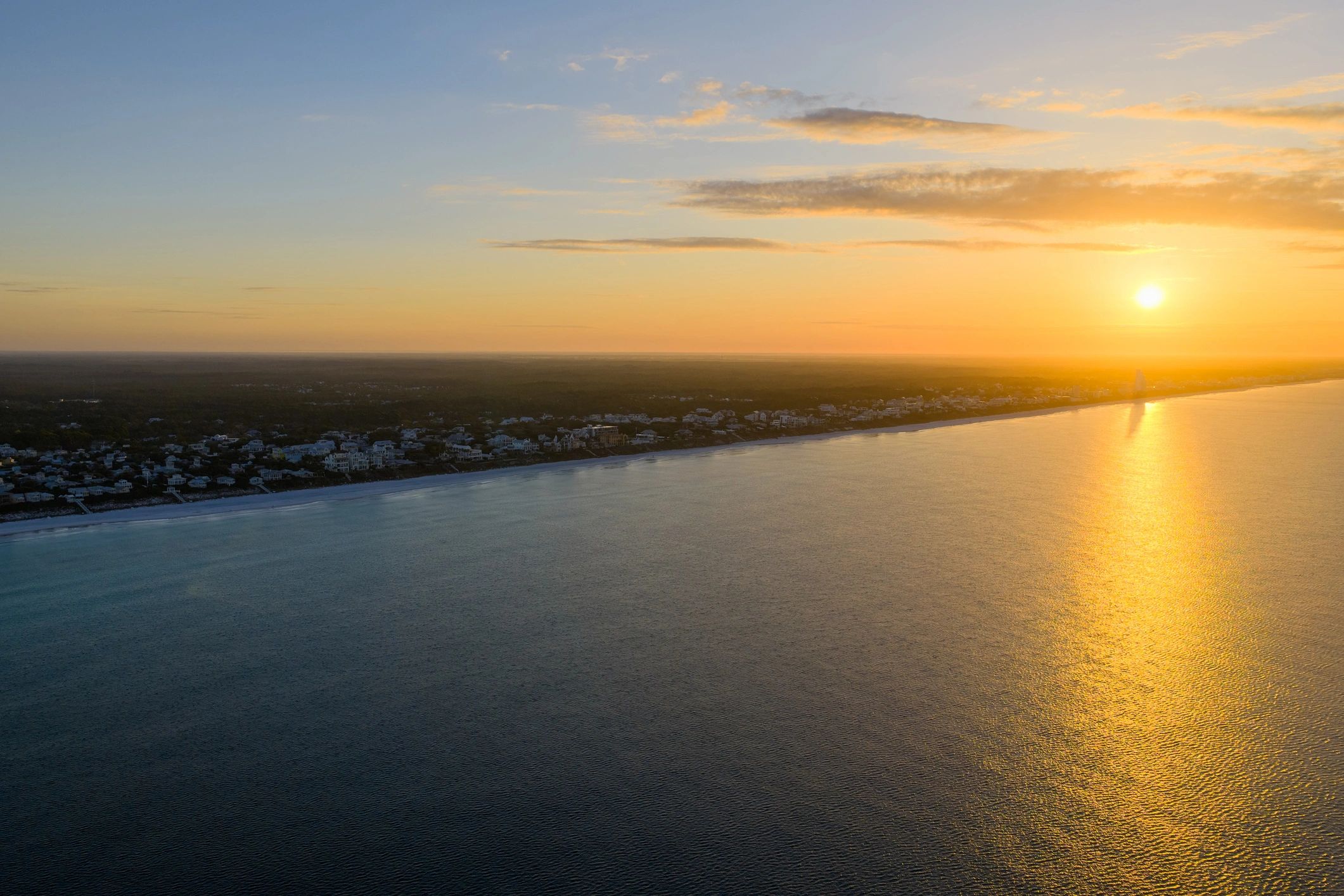 Aerial view of a Florida beach community and coastline at sunset