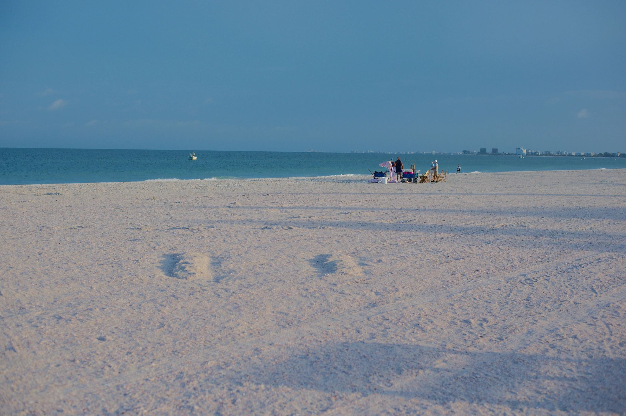 Wide sandy shoreline at St. Pete Beach with calm Gulf water